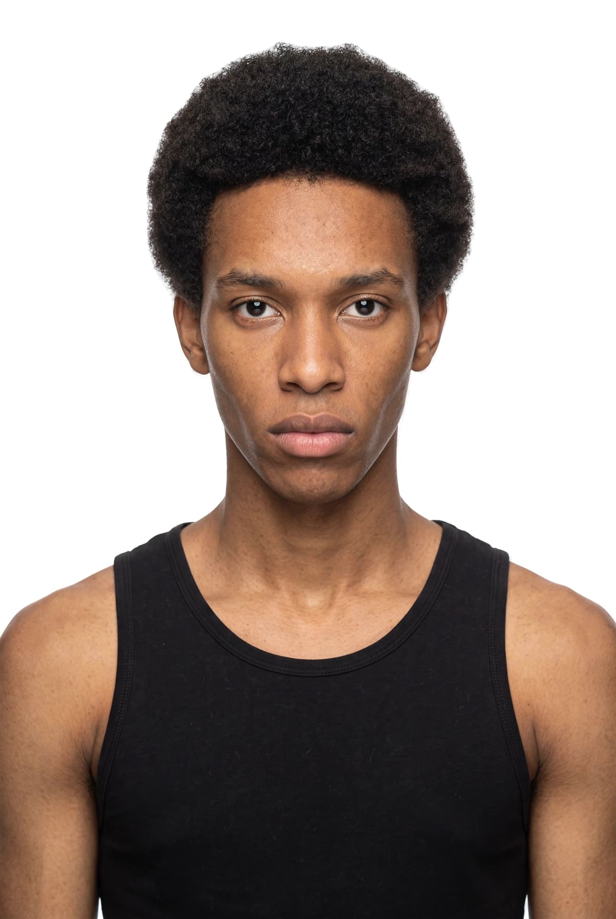 AI-generated male face with short natural curls for the 8M AI Faces catalogue roster