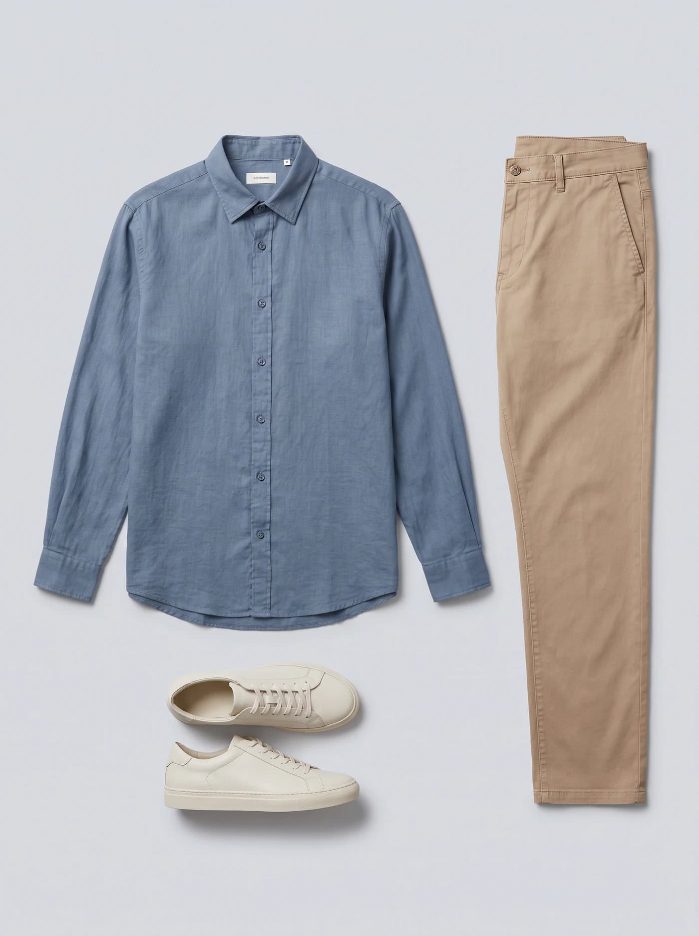 Blue shirt, beige trousers and white shoes supplied as the outfit reference